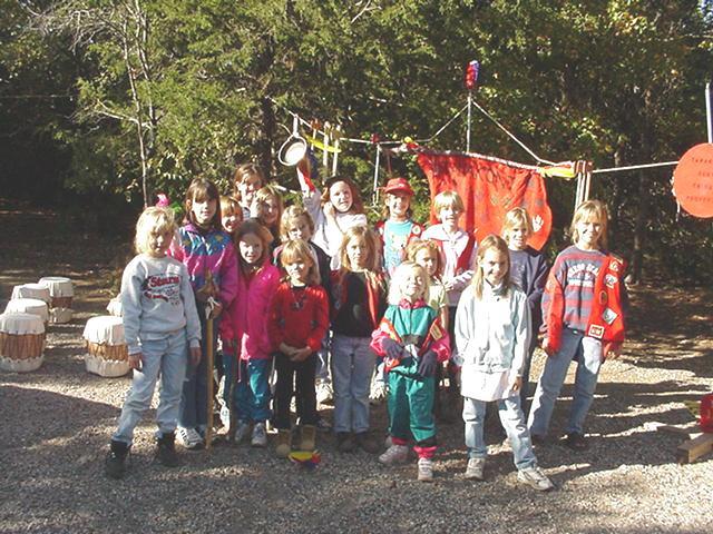 Tawonki tribe holding cooking trophy up.JPG